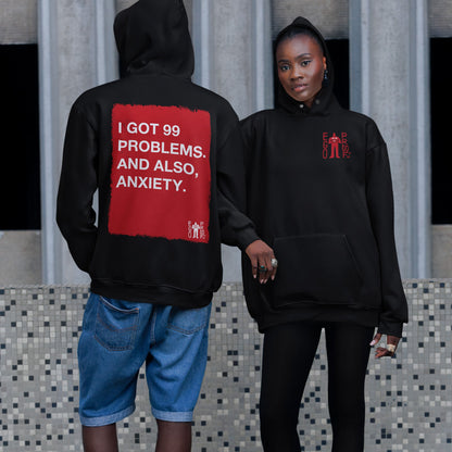 Two people model the 99 Problems Hoodie. One displays the bold back print stating I GOT 99 PROBLEMS. AND ALSO, ANXIETY, while the other showcases the subtle front logo.