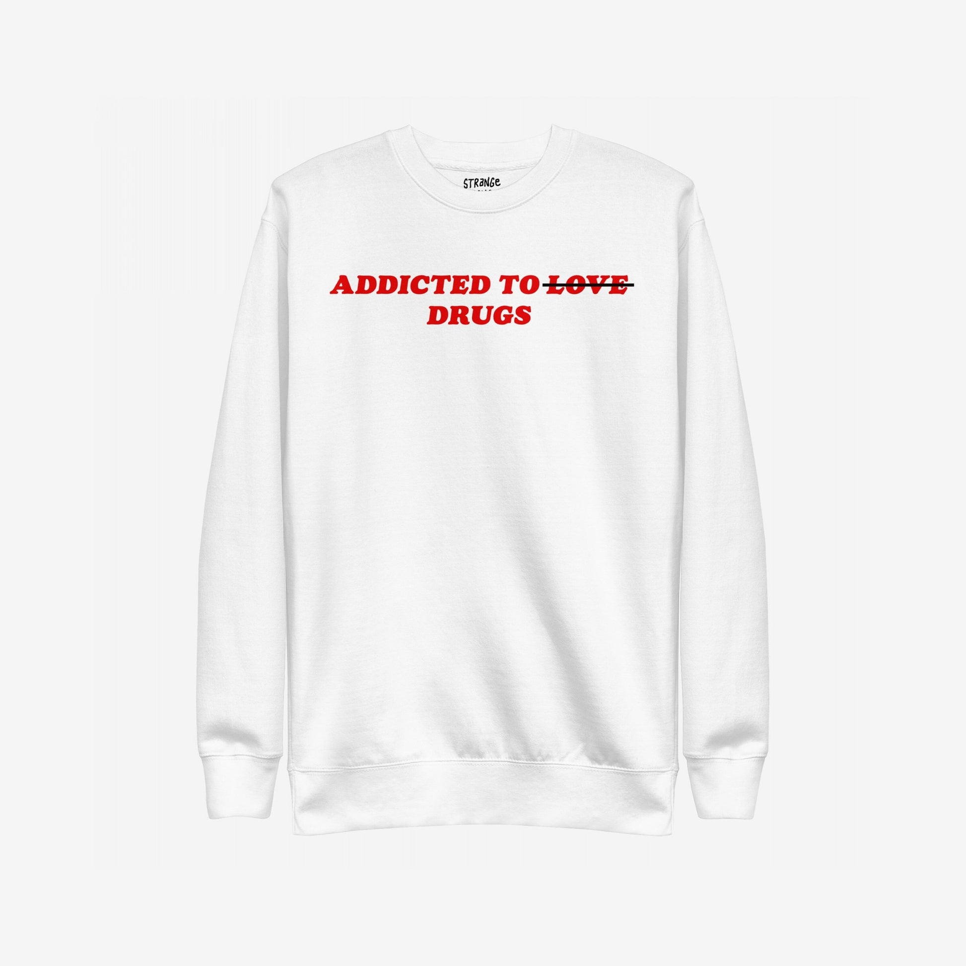 Addicted To Love / Drugs Sweatshirt EU features bold red text on a white crewneck, humorously altering addicted to love to addicted to drugs. Ideal for self-expression and mental health awareness.