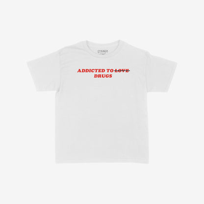 White baby tee with red text "Addicted to ~Love~ Drugs" front print, titled Addicted To Love / Drugs Women's Baby Tee.