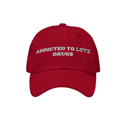 The Egoproof Addicted To Love / Drugs Hat is a red snapback with bold white embroidered text on the front, making a mental he