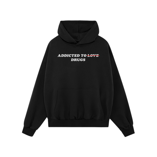 Egoproofs Addicted To Love / Drugs Hoodie features ADDICTED TO LOVE with LOVE crossed out in red and replaced by DRUGS—a bo