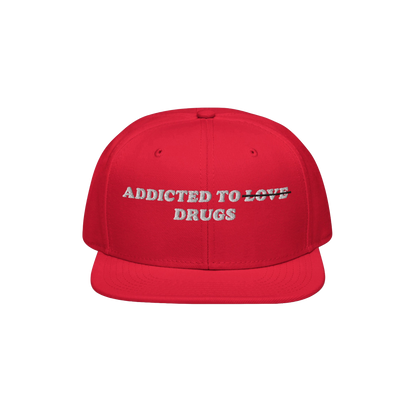 The Egoproof Addicted To Love / Drugs Hat is a bold red embroidered snapback featuring playful text—LOVE struck through and