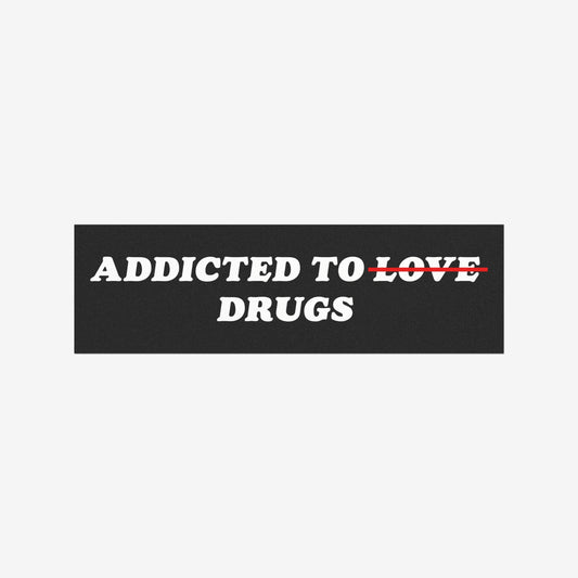Addicted To Love / Drugs Sticker & Magnet features bold text with LOVE struck through, highlighting a quirky twist on addiction themes, suitable for various surfaces. Supports NAMI.