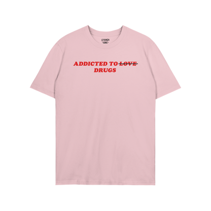 Addicted To Love / Drugs T-shirt in light pink with bold red text "Addicted to ~Love~ Drugs" for anxiety warriors and seroton