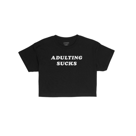 Adulting Sucks Women's Baby Tee in black with bold white text, fitted style, perfect for layering and casual wear.