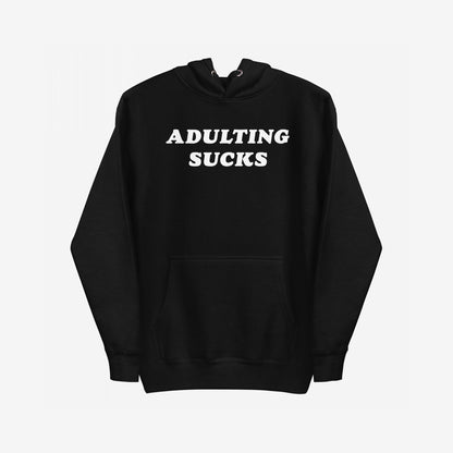 Adulting Sucks Hoodie EU features bold white text ADULTING SUCKS on a black pullover with a kangaroo pocket and drawstring hood, embodying comfort and sarcasm for navigating life's challenges.