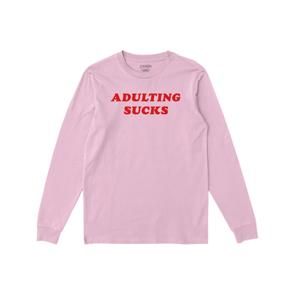 Pink long sleeve Adulting Sucks T-shirt with bold red lettering for a sarcastic, comfy, and casual look.