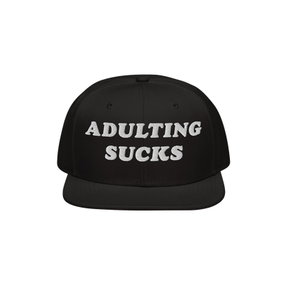 Adulting Sucks Hat featuring a black, flat-brimmed snapback design with “ADULTING SUCKS” embroidered in white. Perfect fo