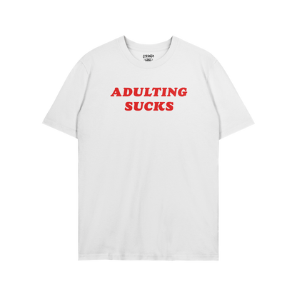 White unisex Adulting Sucks T-shirt with bold red text, perfect for casual wear and sarcastic style.