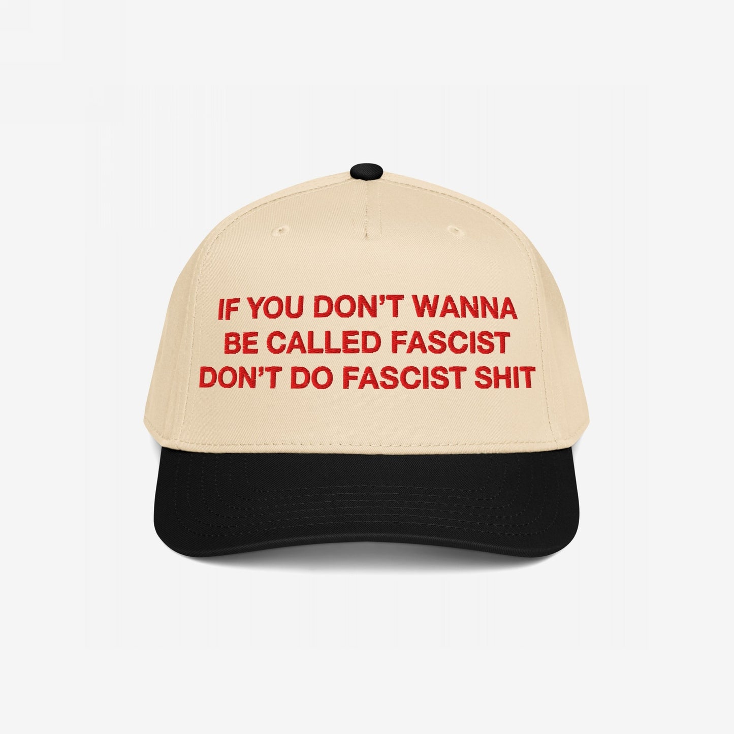Anti-Fascist Hat with beige crown and black brim, featuring bold red embroidery: If you don’t wanna be called fascist, don’t do fascist shit, embodies Egoproof's stand against hate and injustice.