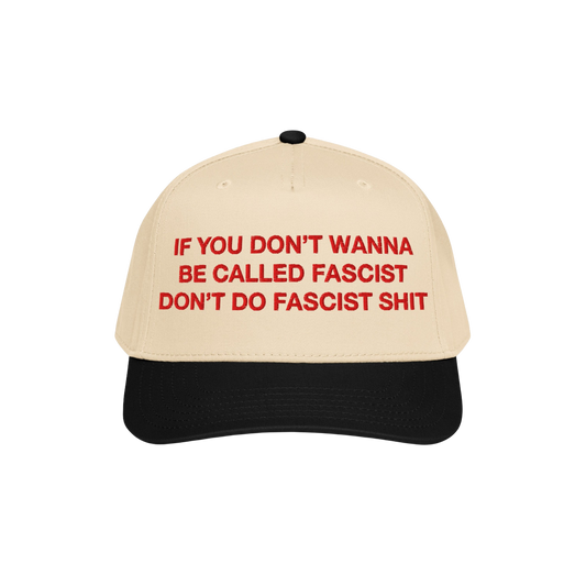 Anti-Fascist Hat with beige crown and black brim, featuring bold red embroidery: If you don’t wanna be called fascist, don�