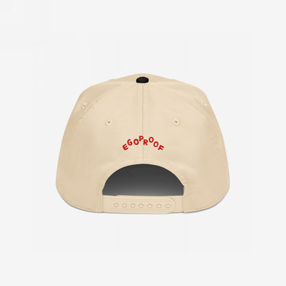 Anti-Fascist Hat, back view: a light-tan baseball cap with EGOPROOF embroidered in red across the back. Features a plastic snapback closure labeled OTTO, embodying bold style and resistance.