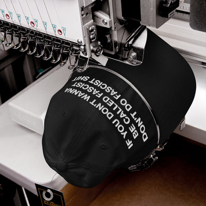 Anti-Fascist Hat in an embroidery machine, stitching the bold slogan “IF YOU DON’T WANNA BE CALLED FASCIST DON’T DO FASCIST SHIT,” embodying Egoproof’s commitment to making powerful statements through wearable art.