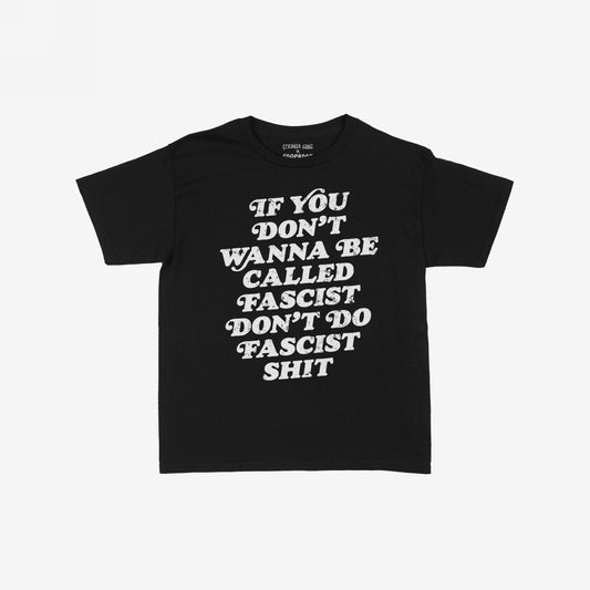 Anti-Fascist Women's Baby Tee featuring bold white text: “If you don’t wanna be called fascist don’t do fascist shit.” A statement piece that combines vintage style with fierce resistance.
