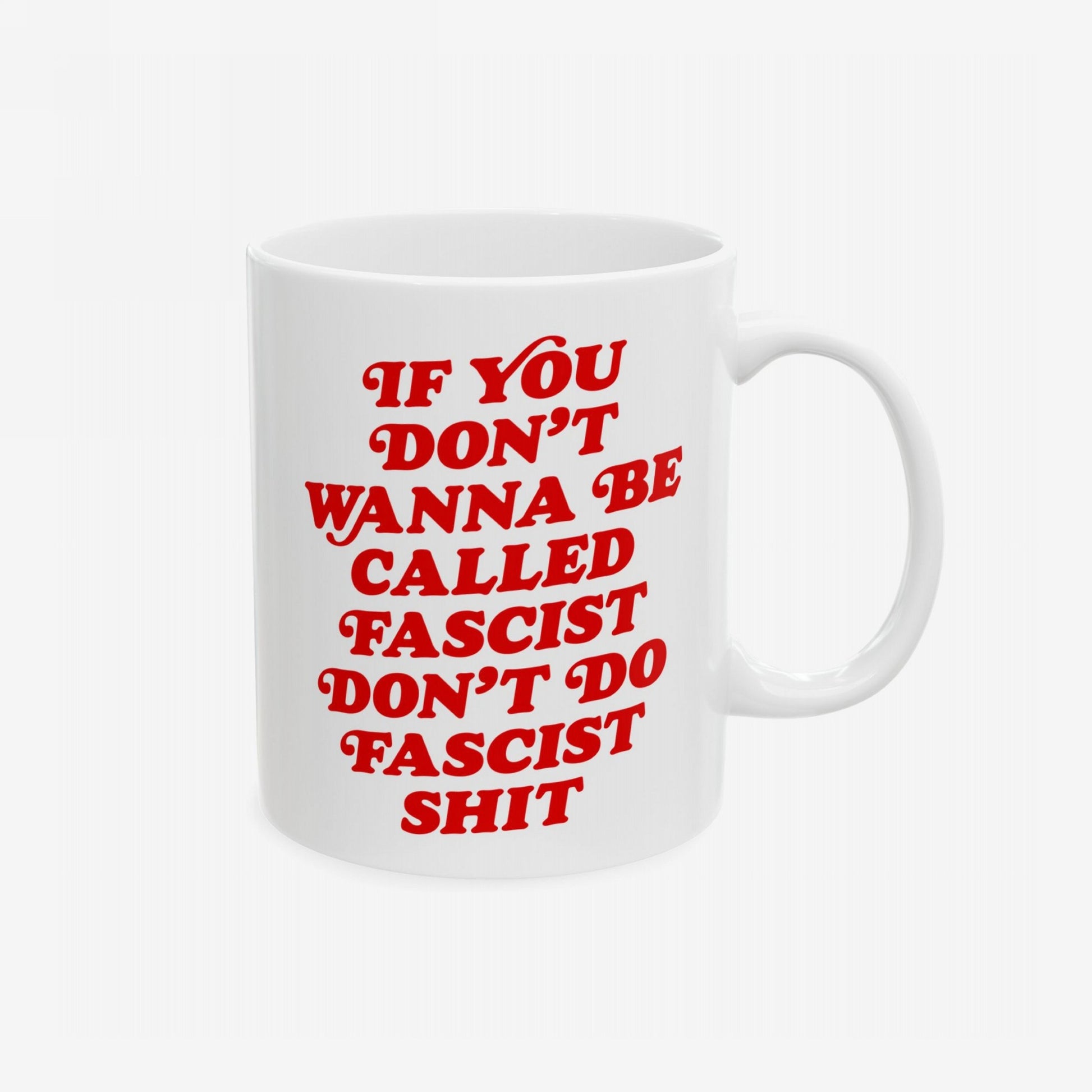 Anti-Fascist Mug featuring a bold, red message promoting resistance. This white ceramic mug is designed for those who face the world's weight, blending vintage style with powerful, fearless statements.