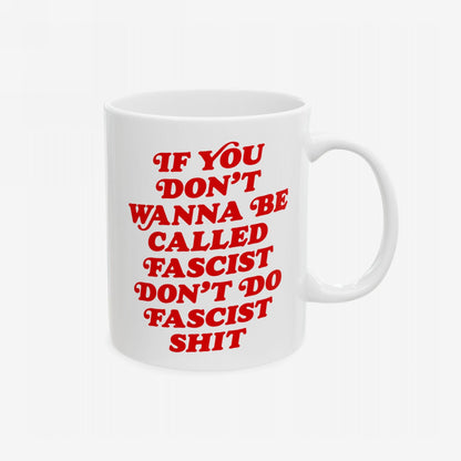 Anti-Fascist Mug featuring a bold, red message promoting resistance. This white ceramic mug is designed for those who face the world's weight, blending vintage style with powerful, fearless statements.