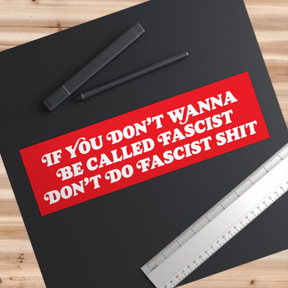 Anti-Fascist Sticker & Magnet on a designer's workspace with a drawing tablet, stylus, and ruler. The bold red design conveys a powerful, unapologetic message against oppression and fascism.