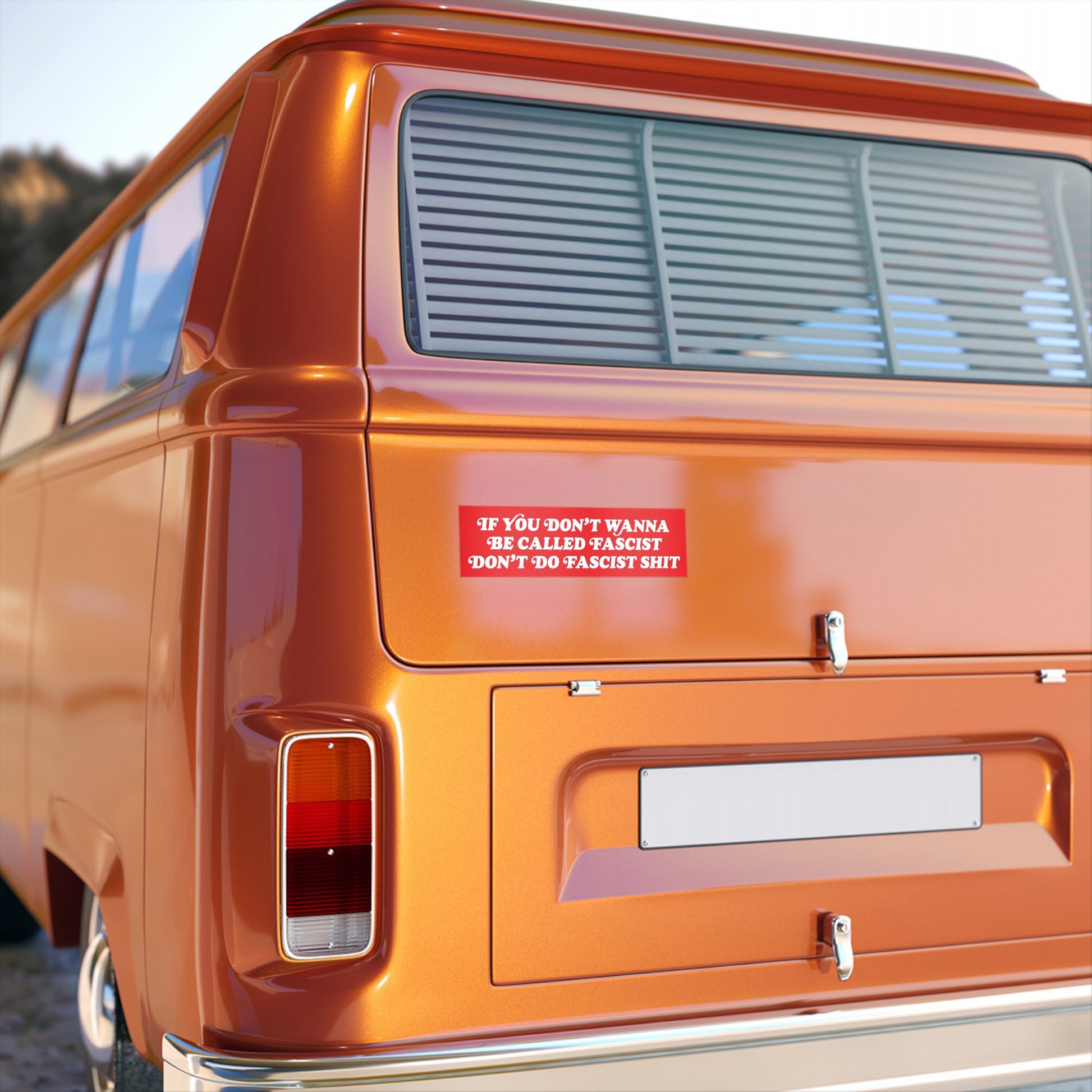 Anti-Fascist Sticker & Magnet on orange vintage camper van's rear, displaying bold resistance message. Features all-weather durability, perfect for expressing strong opposition to fascism with no apologies.