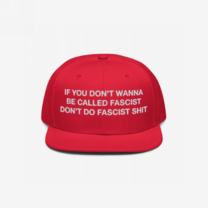 Anti-Fascist Hat featuring bold white embroidered text, If you don’t wanna be called fascist, don’t do fascist shit, on a bright red flat-bill cap, embodies resistance and everyday activism.