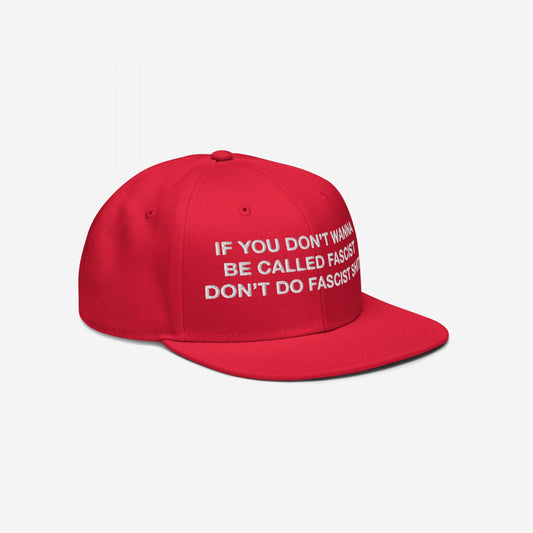 Anti-Fascist Hat featuring bold white embroidery, If you don’t wanna be called fascist don’t do fascist shit, on a red snapback—designed for everyday resistance and visible stance against hate.