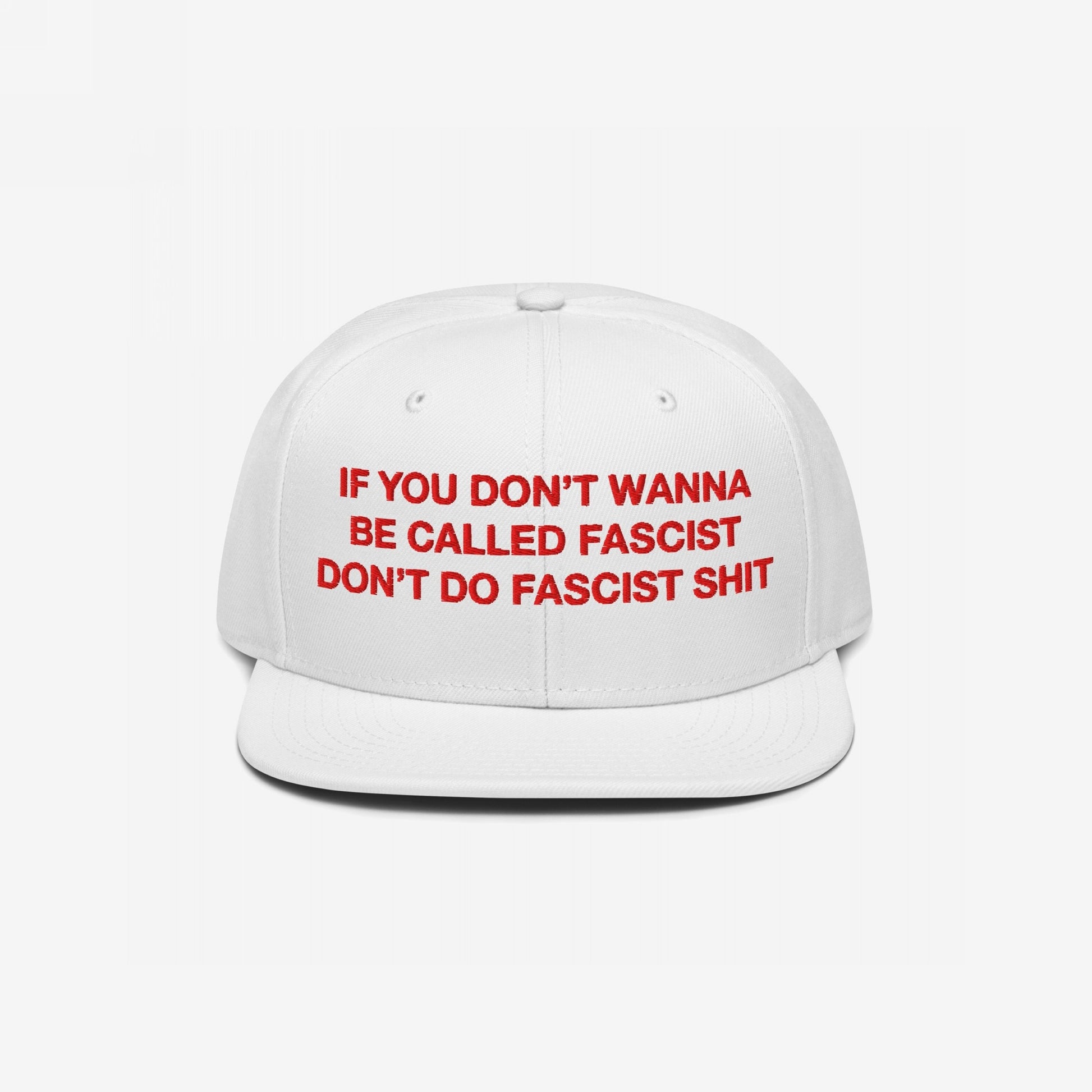 Anti-Fascist Hat with bold red embroidery on a white, flat-brim cap, stating IF YOU DON’T WANNA BE CALLED FASCIST DON’T DO FASCIST SHIT, embodying everyday resistance against hate.