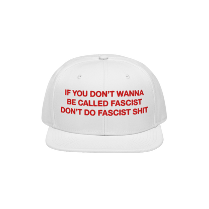 Anti-Fascist Hat with bold red embroidery on a white, flat-brim cap, stating IF YOU DON’T WANNA BE CALLED FASCIST DON’T D