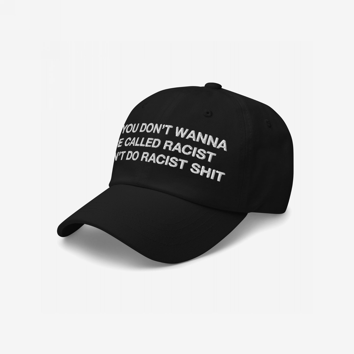Anti-Racist Hat EU: Black cap with white embroidery reading, “If you don’t wanna be called racist, don’t do racist shit,” representing a bold, anti-racist statement.