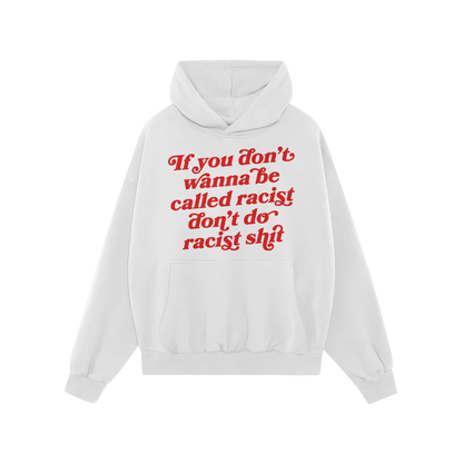 Anti-Racist Hoodie: A plain white pullover with a kangaroo pocket, featuring bold red script that reads, If you don’t wanna