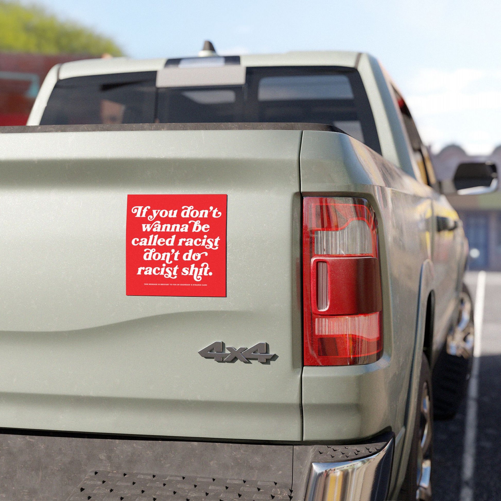 Anti-Racist Sticker & Magnet on a 4x4 pickup tailgate, displaying bold, white script on red. Perfect for making a clear, impactful statement against racism with durable, all-weather materials.