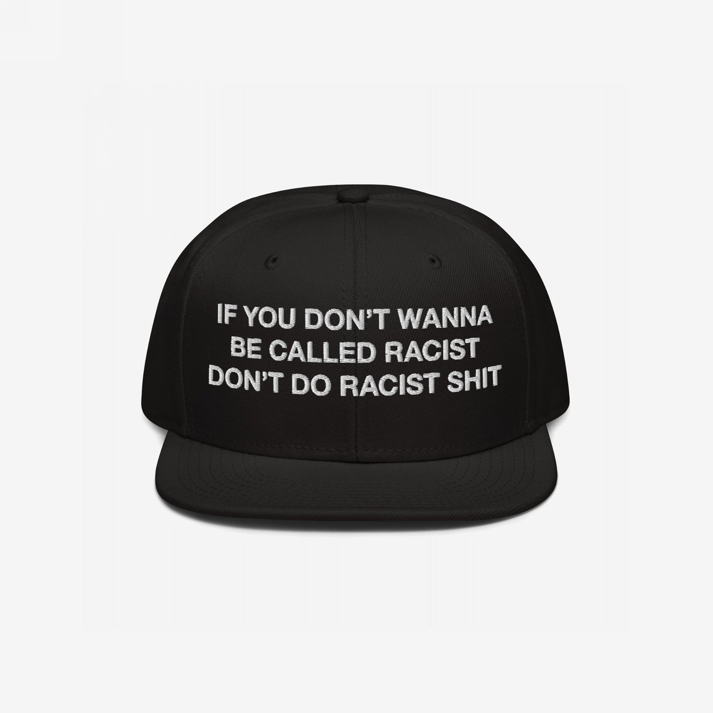 Anti-Racist Hat EU features bold white embroidery on a black flat-brim cap, stating, “IF YOU DON’T WANNA BE CALLED RACIST DON’T DO RACIST SHIT,” promoting an anti-racist message with style and defiance.