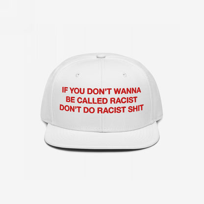 Anti-Racist Hat EU: White flat-brim cap with bold red embroidery stating, IF YOU DON’T WANNA BE CALLED RACIST DON’T DO RACIST SHIT. A strong, stylish statement against racism.