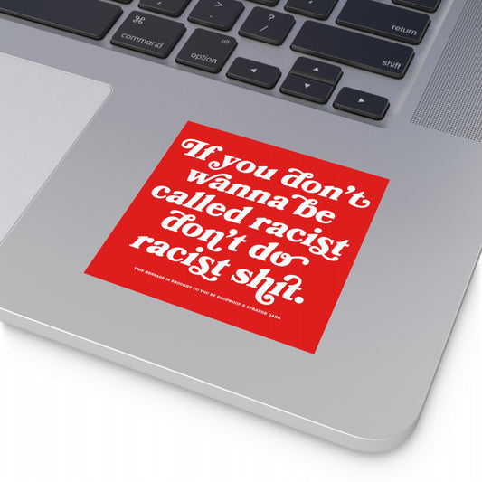 Anti-Racist Sticker & Magnet on silver laptop palm-rest, featuring bold message advocating against racism. Red square design with impactful text, emphasizing the store's commitment to powerful, visible statements.