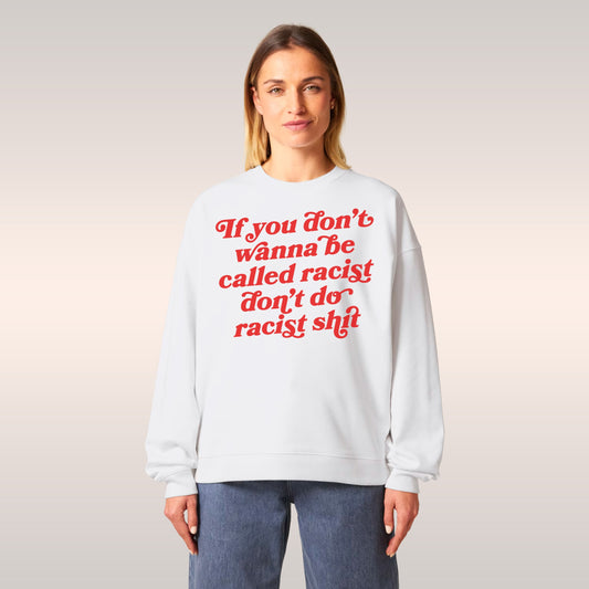 Red crewneck sweatshirt with bold white text front design from the Anti-Racist Hoodie & Sweatshirt collection, unisex and sty