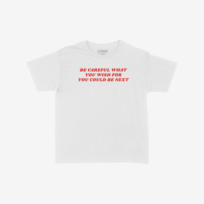 Be Careful Kids T-shirt EU features bold red text warning, BE CAREFUL WHAT YOU WISH FOR YOU COULD BE NEXT, empowering young voices against silence. Collaboration supports ACLU.