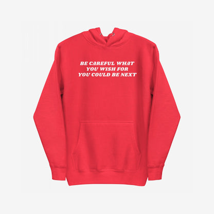The Be Careful Hoodie EU features a bold warning slogan across the chest, ideal for activists and disruptors. This unisex midweight hoodie embodies everyday rebellion and supports the ACLU.