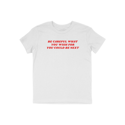 White Be Careful Kids T-shirt with bold red text "Be Careful What You Wish For You Could Be Next" in unisex fit.