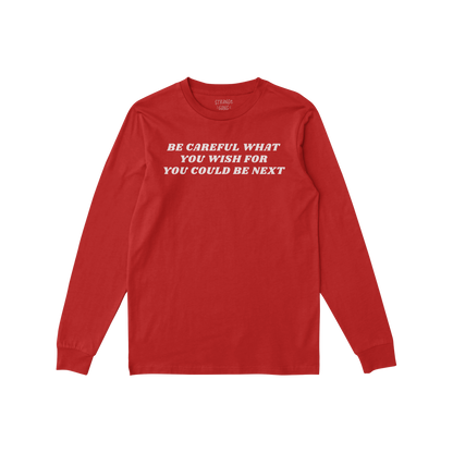 Be Careful Long Sleeve T-shirt in red with bold white text "Be Careful What You Wish For You Could Be Next" on the back.