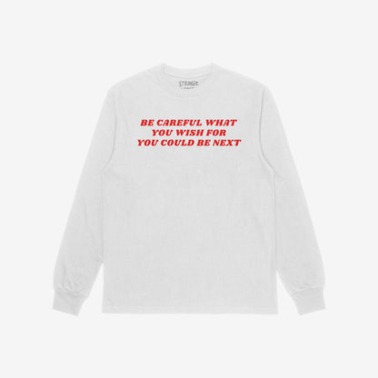 Be Careful Long Sleeve T-shirt in white with bold red text Be Careful What You Wish For You Could Be Next on front.