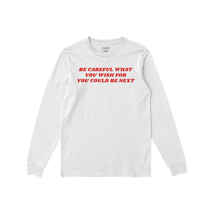 Be Careful Long Sleeve T-shirt in white with bold red text Be Careful What You Wish For You Could Be Next on front.