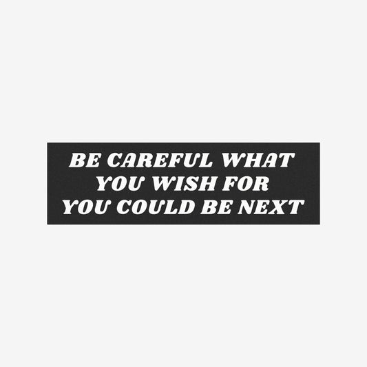 Be Careful Sticker & Magnet features bold white text on a black rectangular background, declaring BE CAREFUL WHAT YOU WISH FOR YOU COULD BE NEXT, a statement piece for cars or fridges.