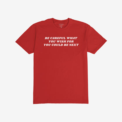 Red Be Careful T-shirt featuring bold white text "Be Careful What You Wish For You Could Be Next" for rallies and resistance.