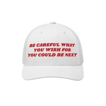 White mesh-back baseball cap, Be Careful Hat, featuring bold red embroidered text: BE CAREFUL WHAT YOU WISH FOR YOU COULD BE 