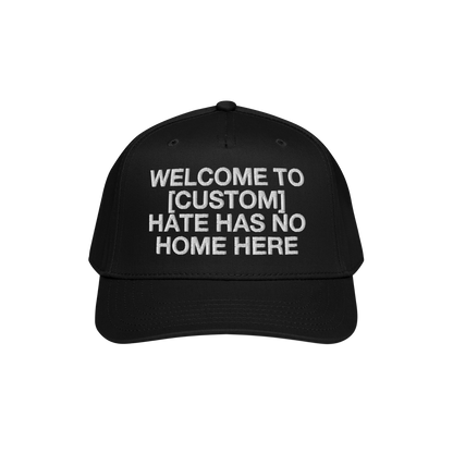 Black Custom Hate Has No Home Here 5-Panel Hat with adjustable snapback and bold welcoming message for unity and inclusion.