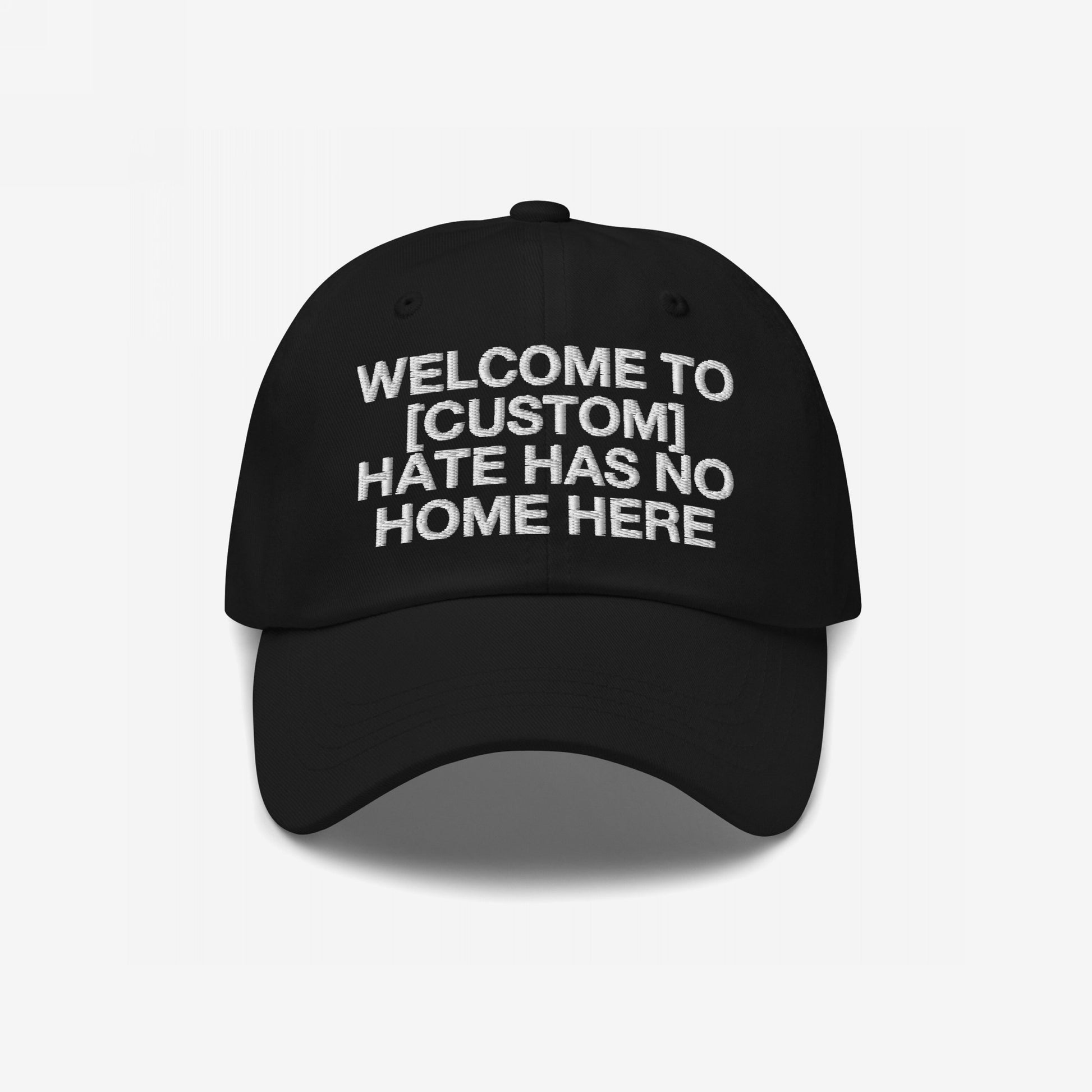 Custom Hate Has No Home Here Dad Hat in black with bold embroidered message promoting love and inclusion on a classic adjustable fit cap.