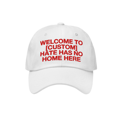 White Custom Hate Has No Home Here Dad Hat with red embroidered bold text promoting love and inclusivity, adjustable strap an
