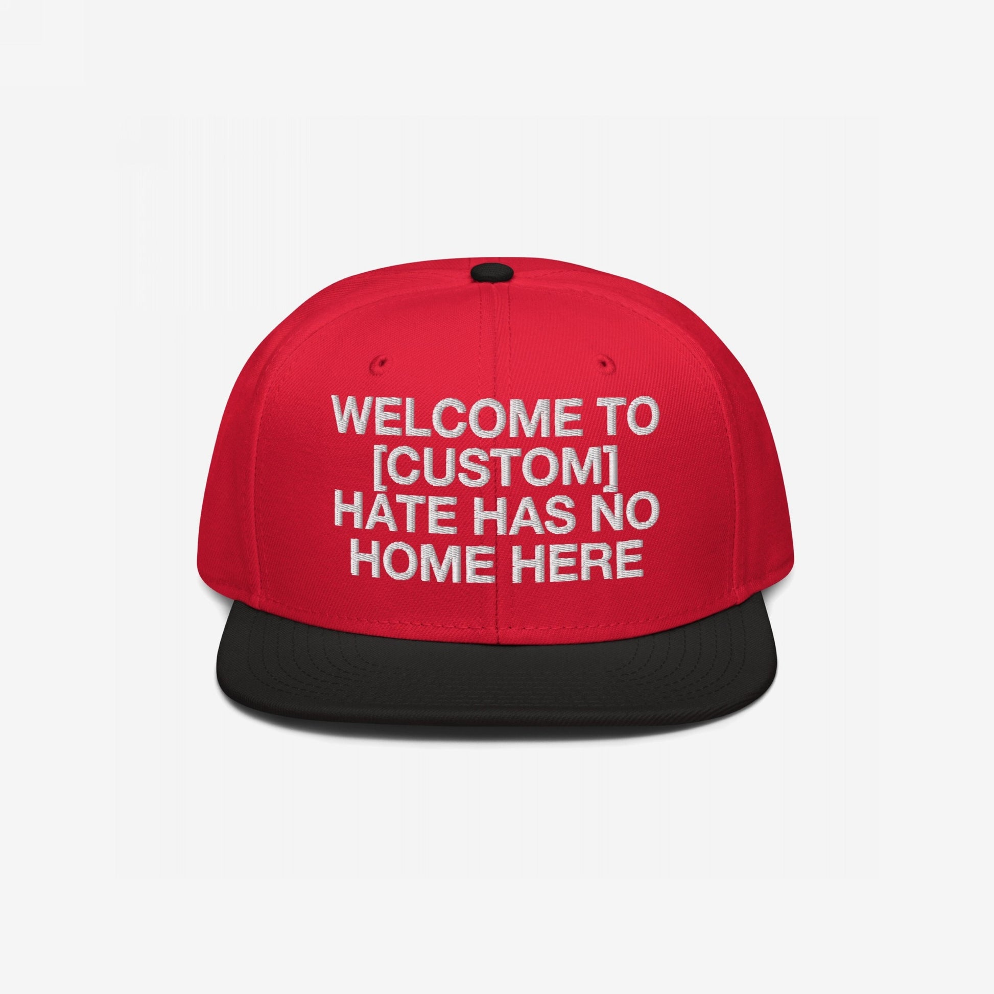 Custom Hate Has No Home Here Snapback Hat in red with black bill featuring bold embroidered customizable welcome message