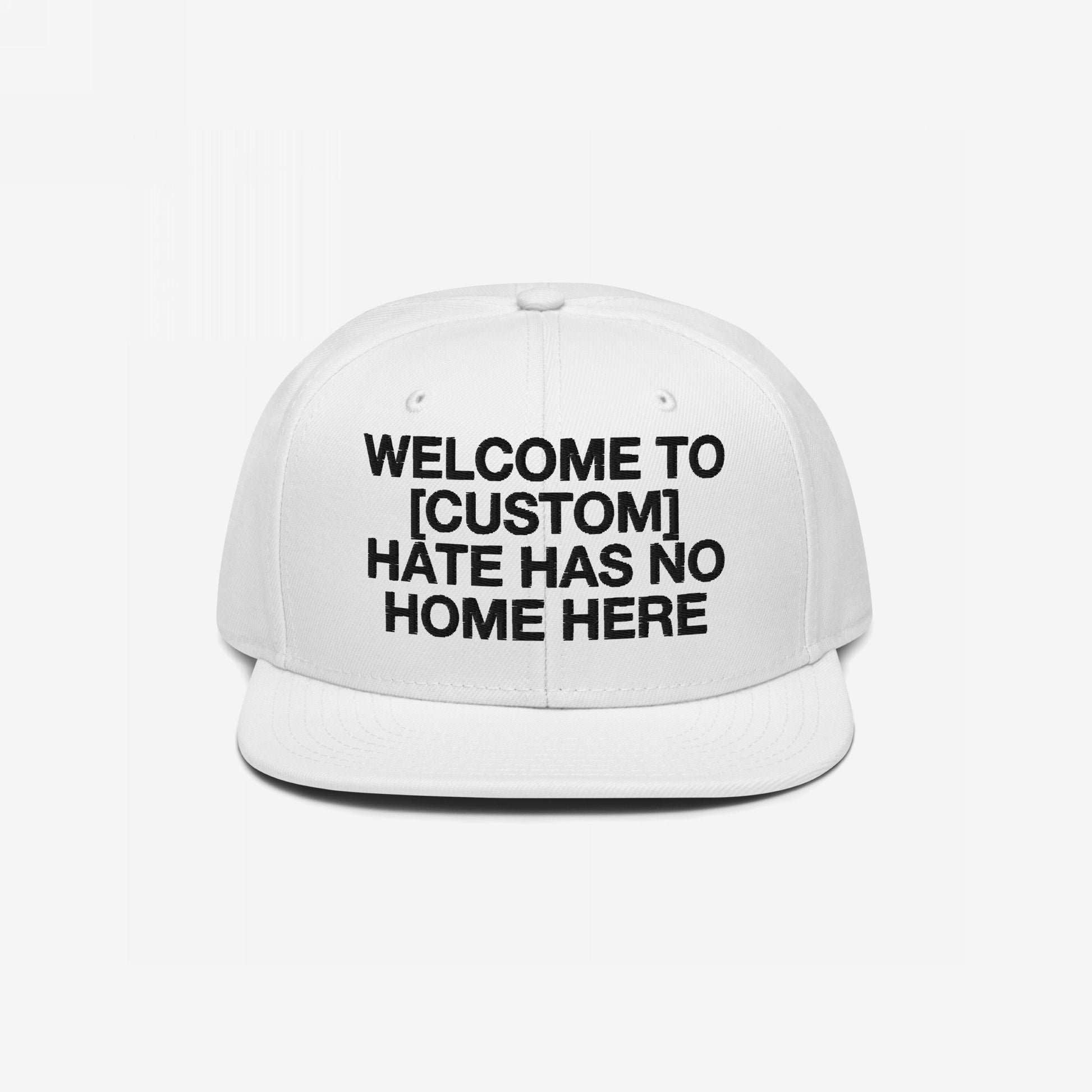 Custom Hate Has No Home Here Snapback Hat in white with bold black embroidery and flat bill, customizable for inclusive messages.
