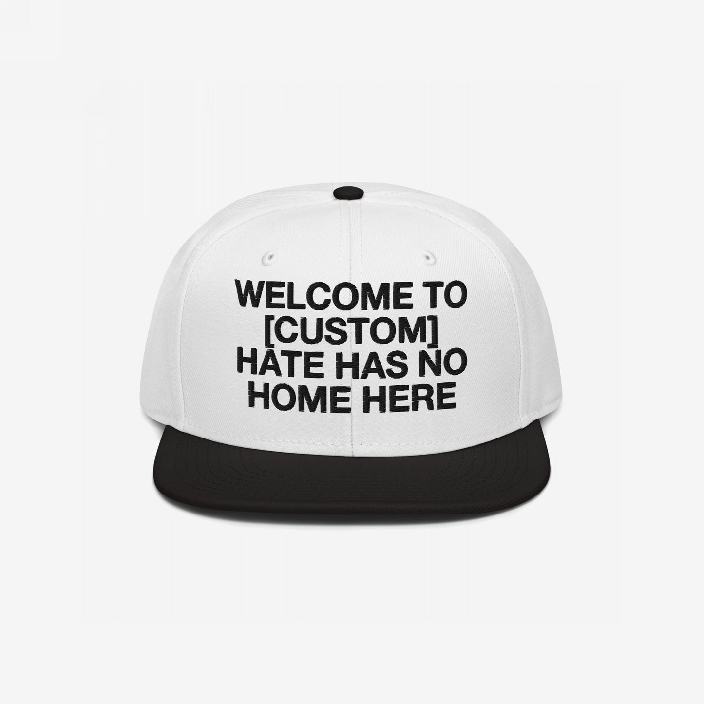 Custom Hate Has No Home Here Snapback Hat in white and black with bold embroidery promoting inclusivity and adjustable fit