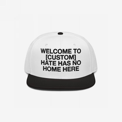 Custom Hate Has No Home Here Snapback Hat in white and black with bold embroidery promoting inclusivity and adjustable fit