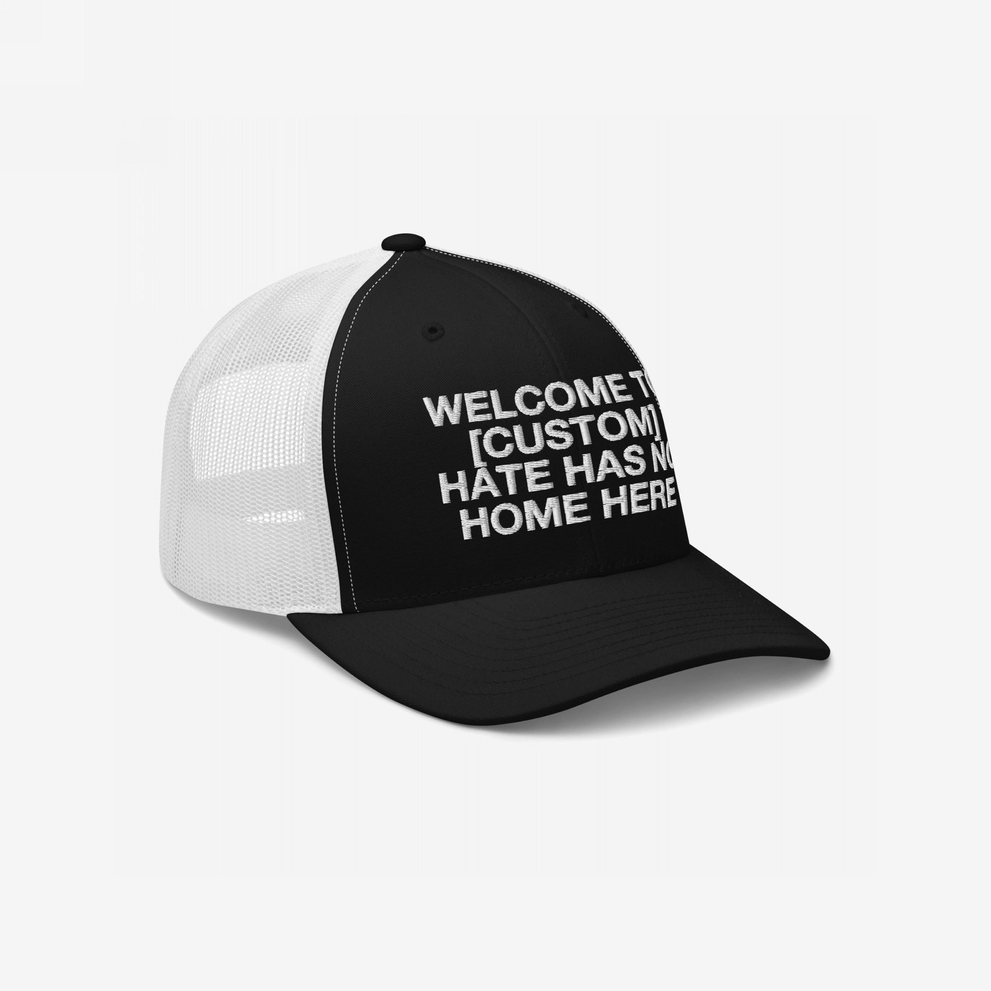 Custom Hate Has No Home Here Trucker Hat with breathable mesh back and adjustable snap closure featuring the message Welcome to [Custom].